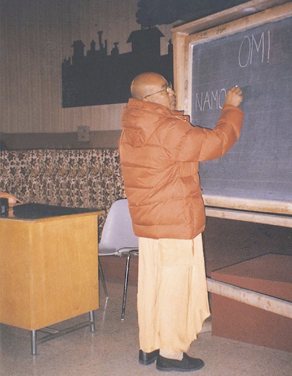 Maharaja lectures at the blackboard